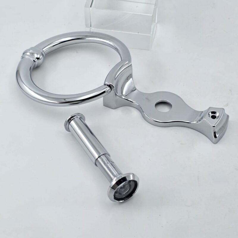 silver door knocker with door viewer