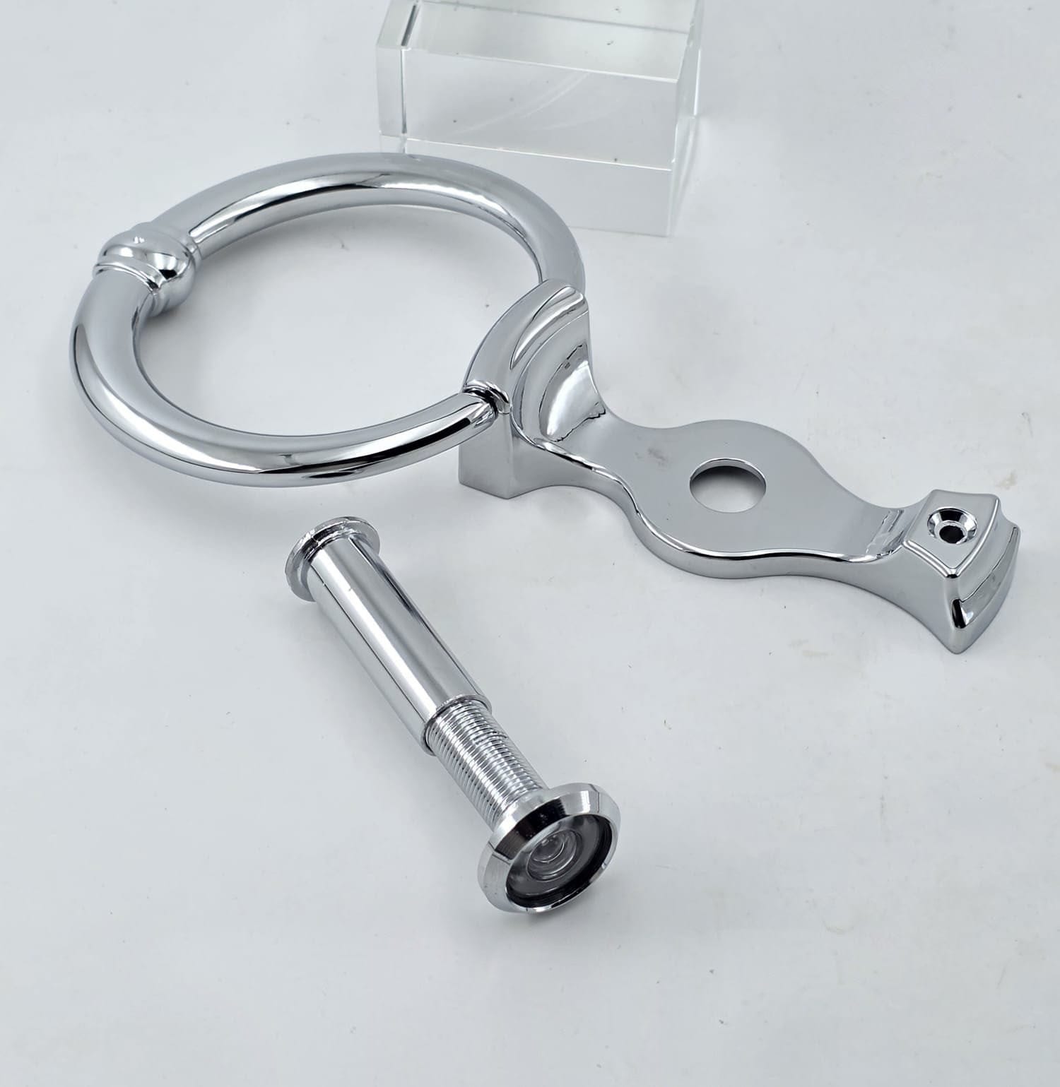 silver door knocker with door viewer